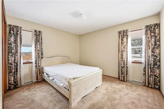 a bed room with a bed and a window