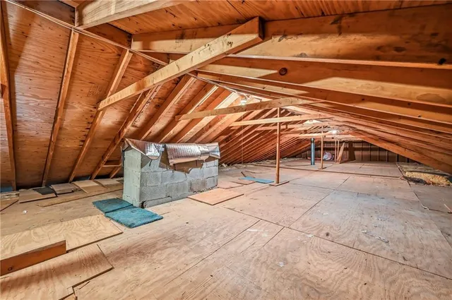 a view of a room with wooden floor and stairs