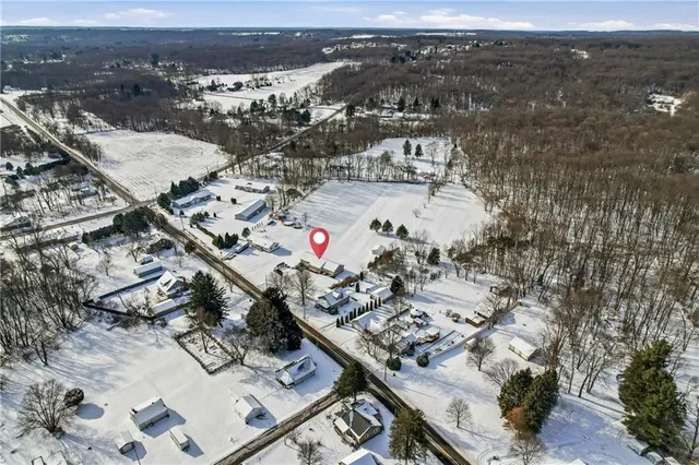 an aerial view of residential houses with outdoor space