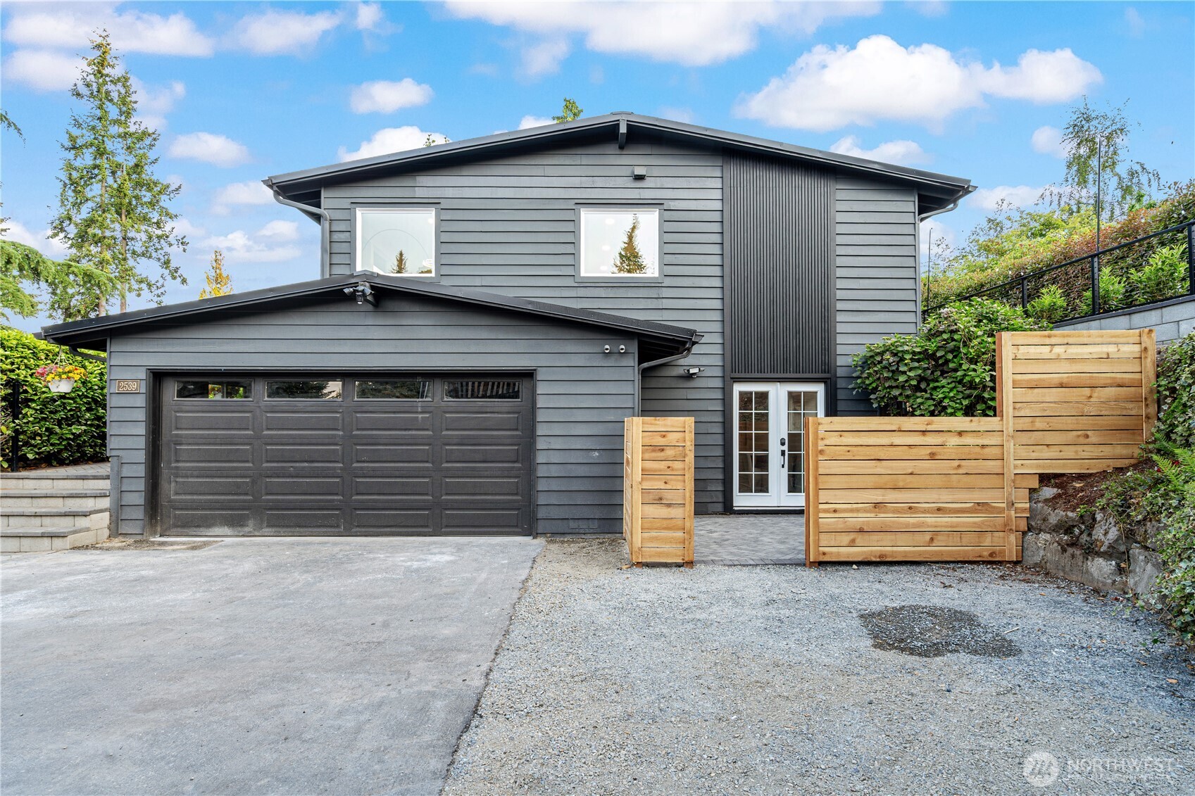 a front view of a house with a garage