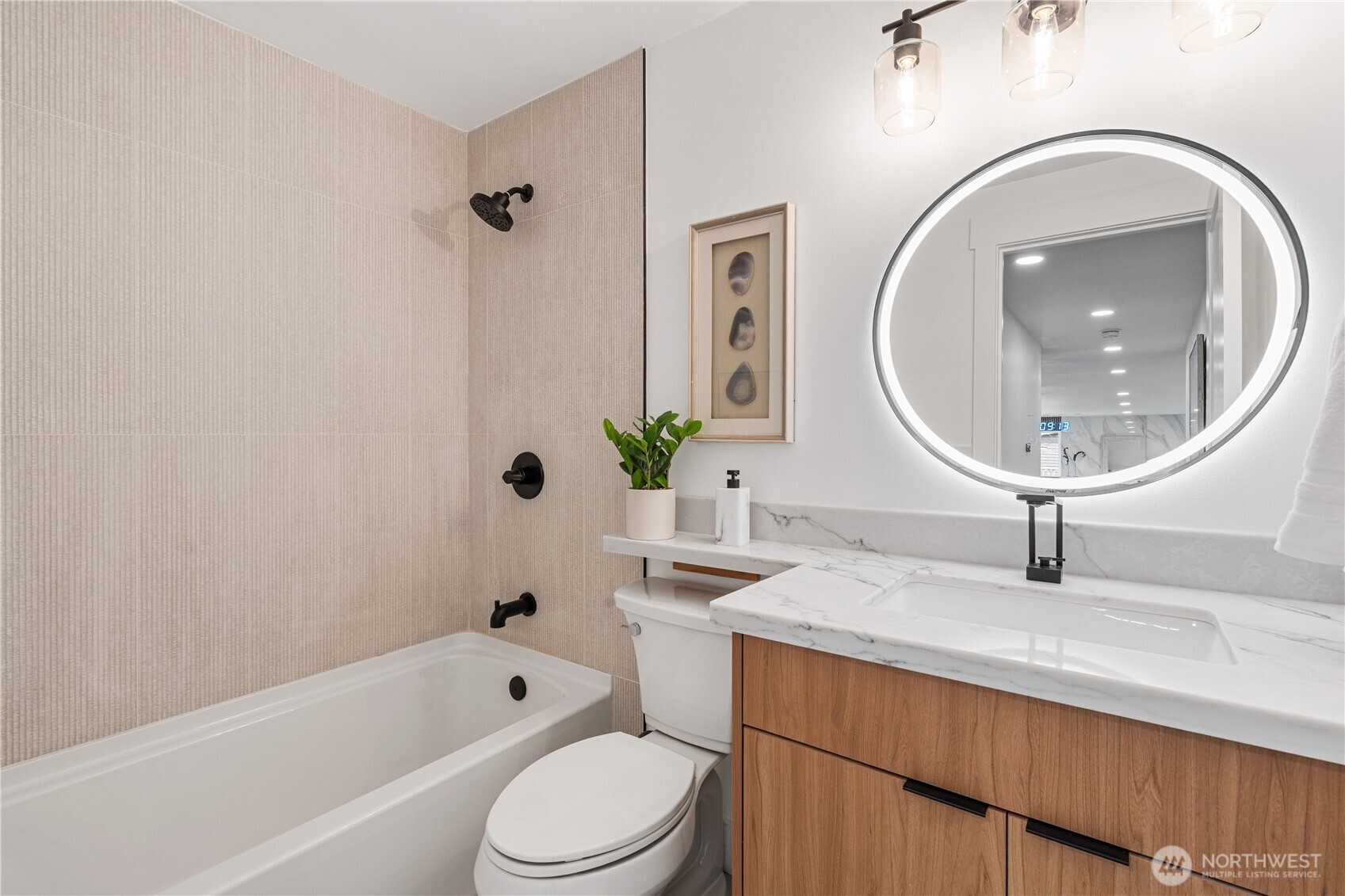 2539 128th Avenue Southeast Bellevue, WA 98005 - Photo 20 of 39 a bathroom with a sink a toilet and a mirror