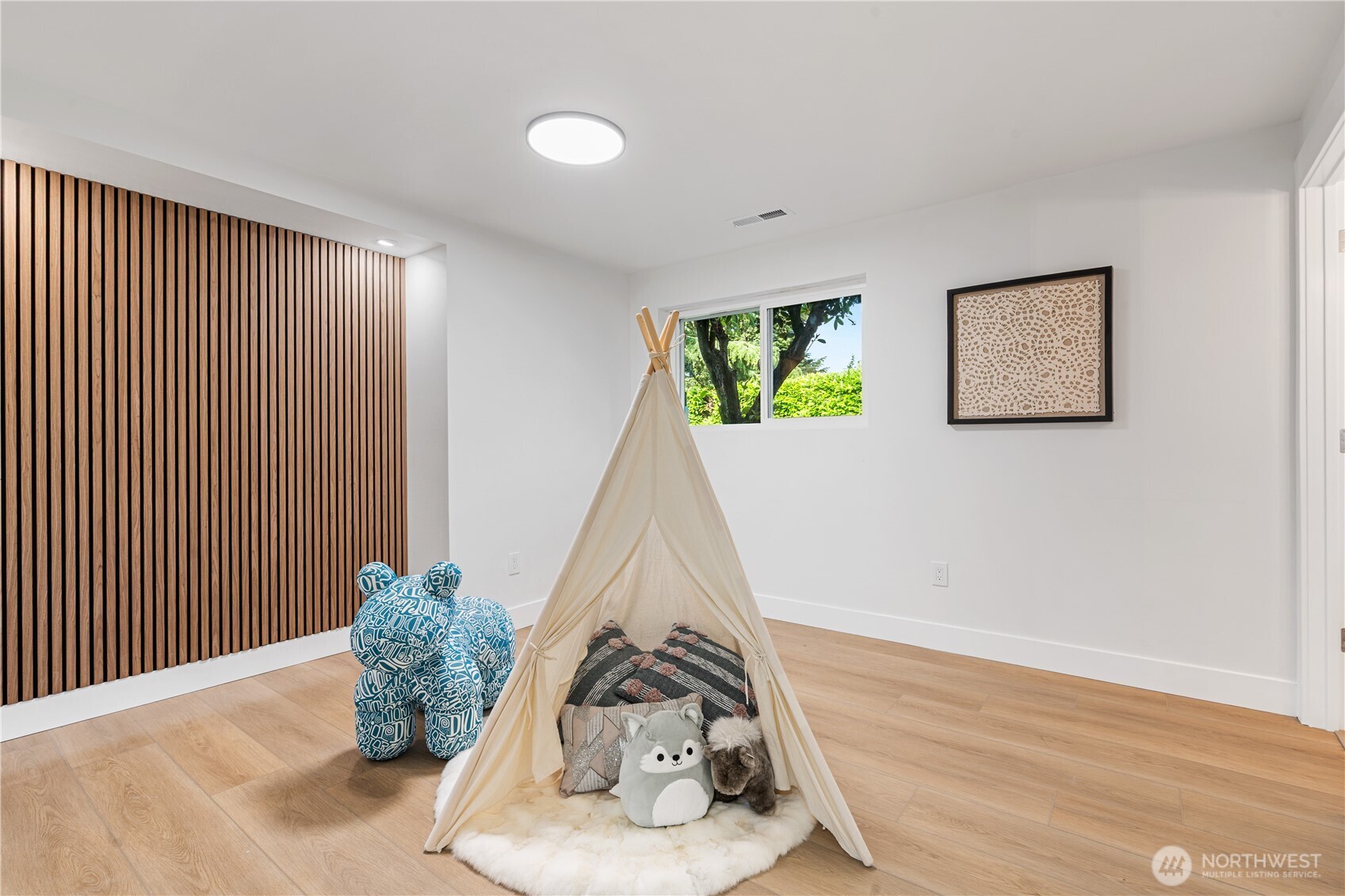 2539 128th Avenue Southeast Bellevue, WA 98005 - Photo 26 of 39 a view of a room with wooden floor and window