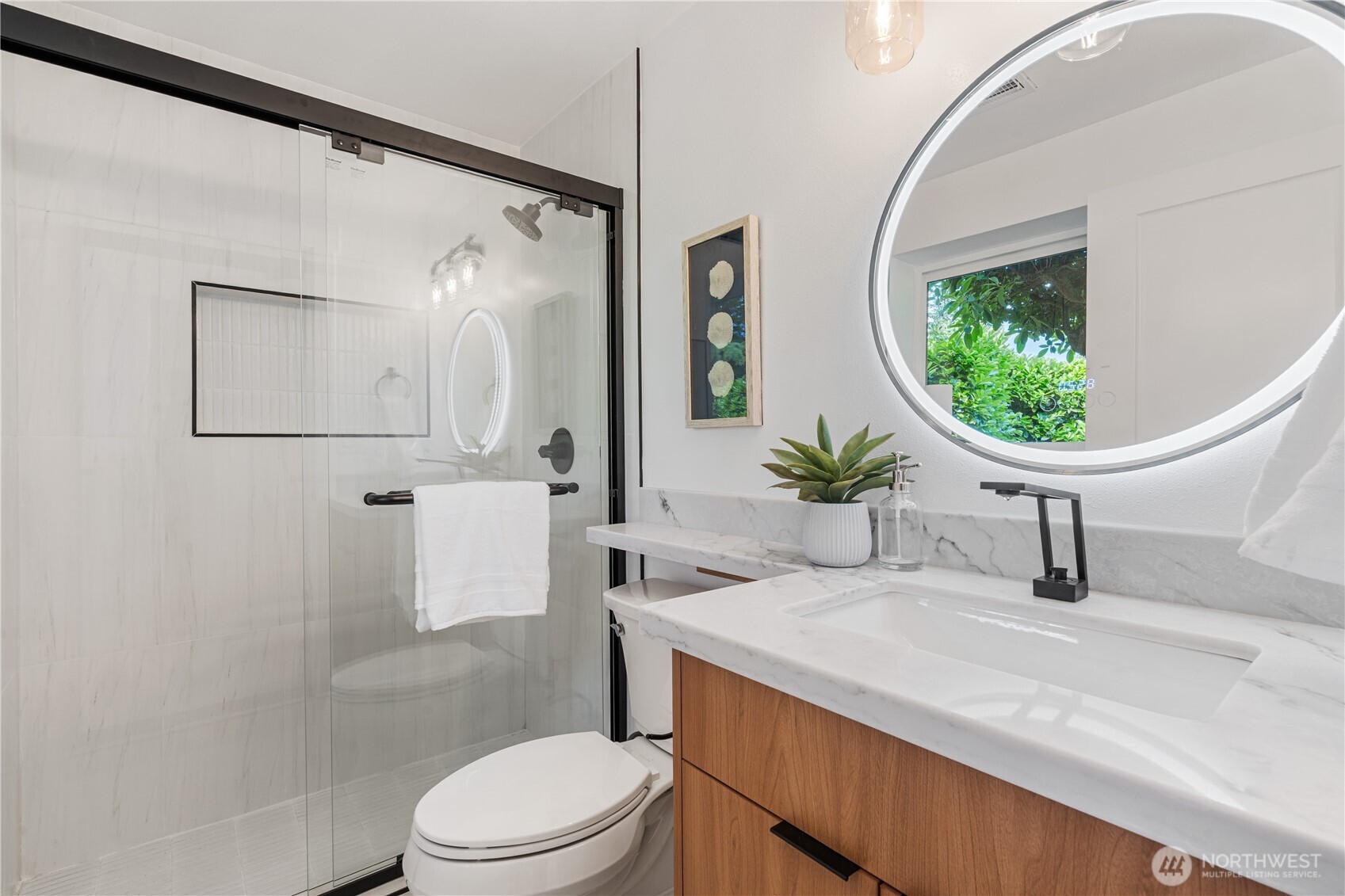 2539 128th Avenue Southeast Bellevue, WA 98005 - Photo 28 of 39 a bathroom with a sink a toilet and a mirror