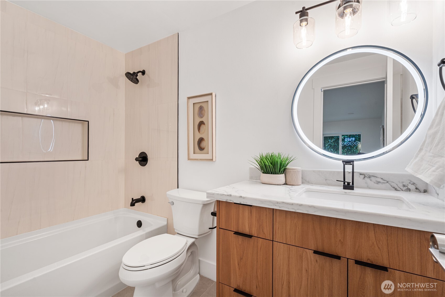 2539 128th Avenue Southeast Bellevue, WA 98005 - Photo 31 of 39 a bathroom with a granite countertop toilet sink and mirror