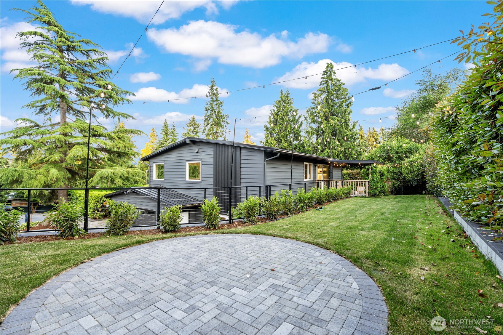 2539 128th Avenue Southeast Bellevue, WA 98005 - Photo 35 of 39 a front view of a house with a yard and trees