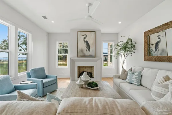 a living room with furniture and a fireplace