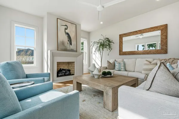 a living room with furniture and a fireplace
