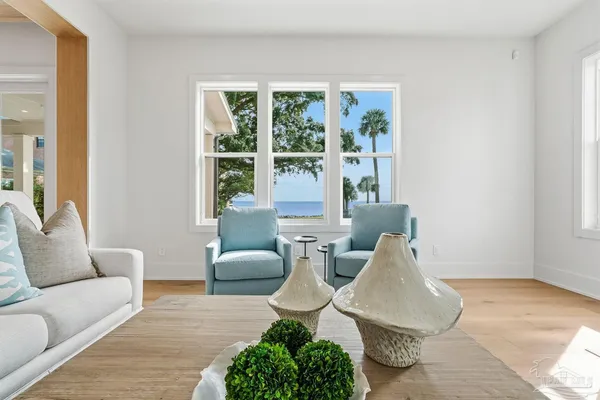 a living room with furniture and a large window