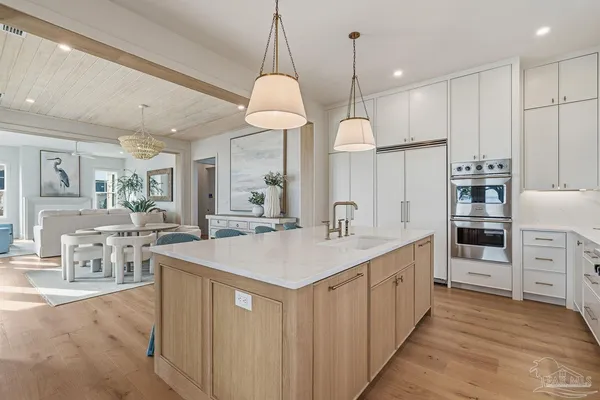 a kitchen with stainless steel appliances granite countertop a stove and a sink