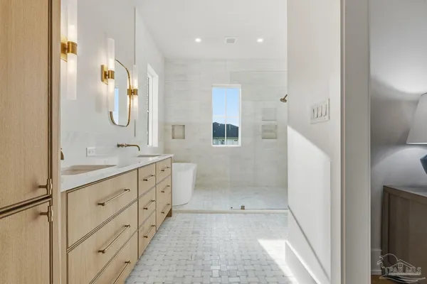 a view of a bathroom with a tub and shower