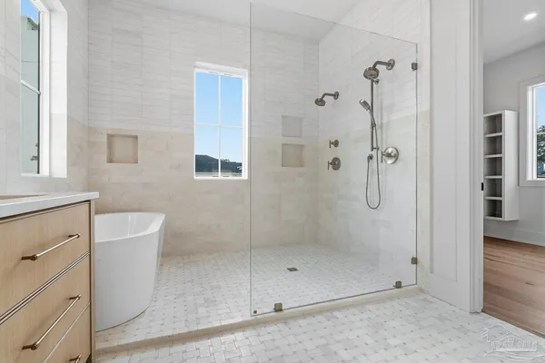 a bathroom with a sink toilet and shower
