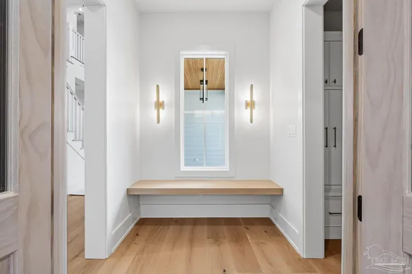 a view of a bathroom with wooden floor and a sink