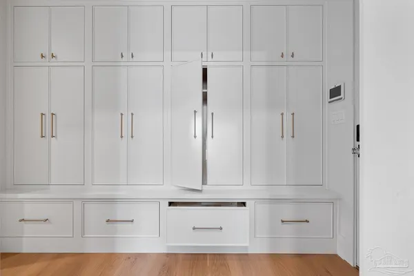 a en suite bathroom with a granite countertop sink a mirror and a