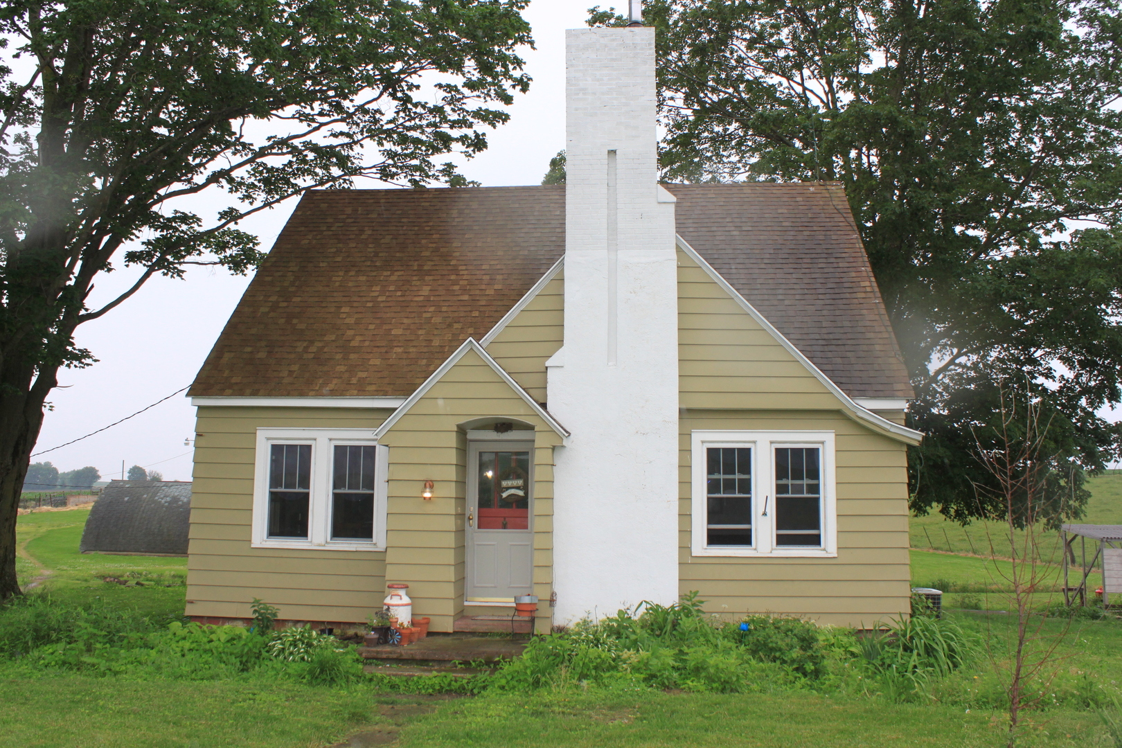 26585 Clark Road Sterling, IL 61081 - Photo 14 of 14 a view of a house with a yard