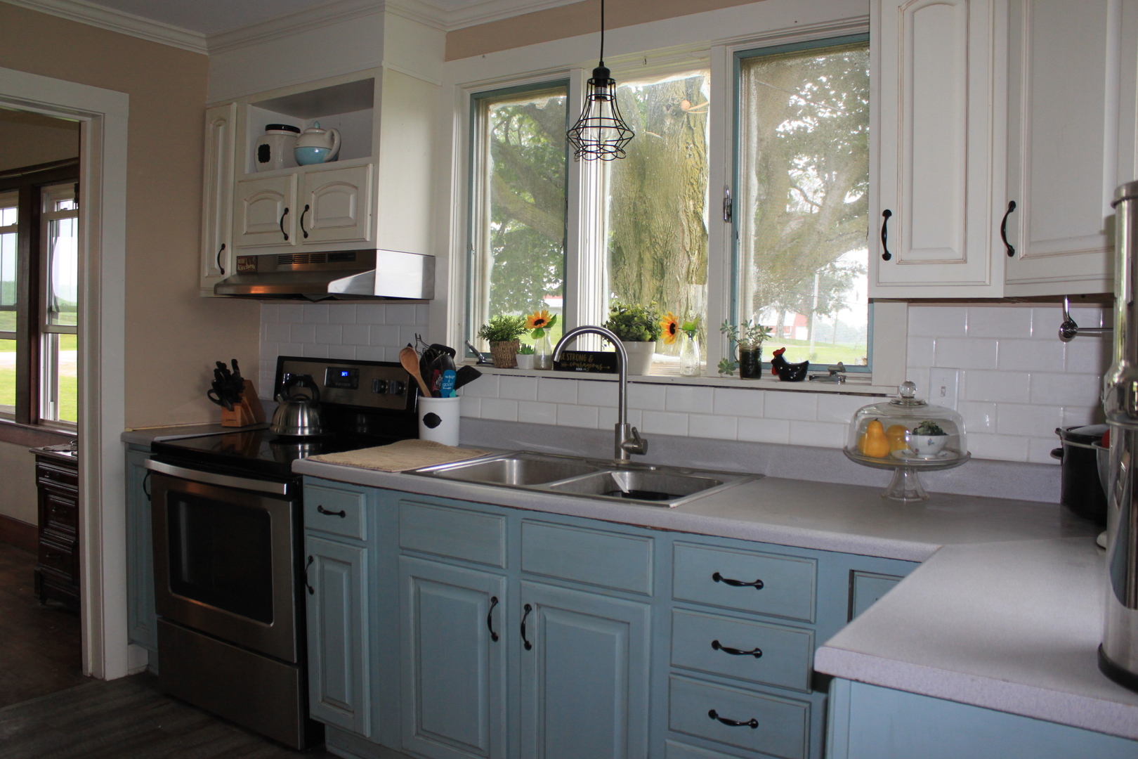 26585 Clark Road Sterling, IL 61081 - Photo 5 of 14 a kitchen with stainless steel appliances a sink a stove and a window