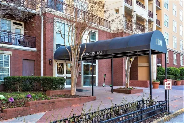a view of a building with sitting area