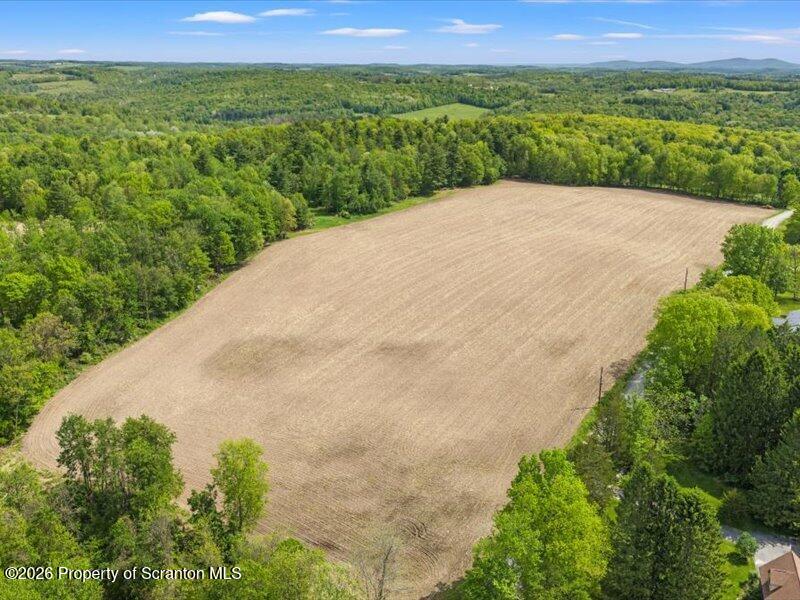 9-17 Vago Road Tunkhannock, PA 18657 - Photo 40 of 57 a view of a lush green field with a yard
