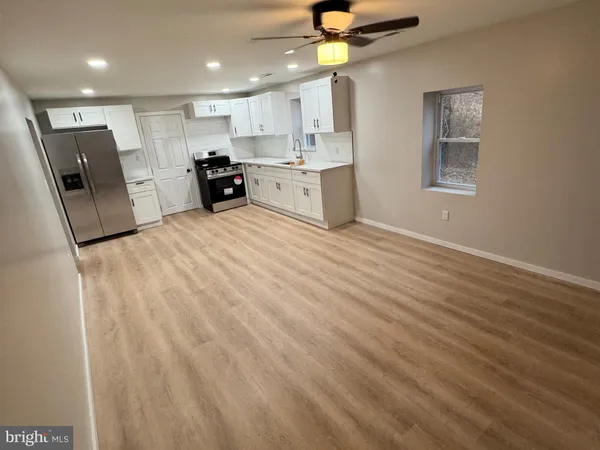 a view of a kitchen with electric appliances