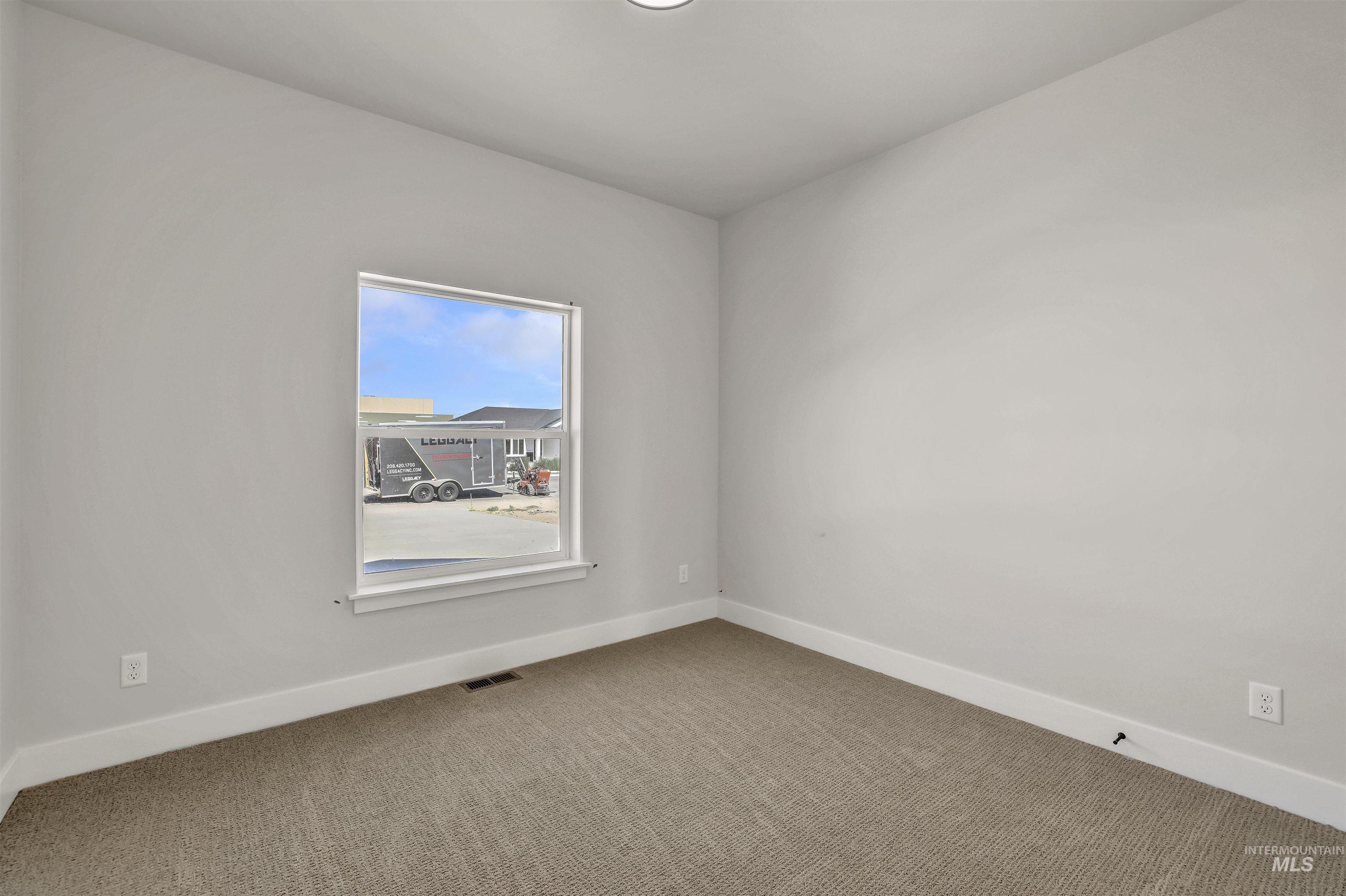 941 Gregory Way Twin Falls, ID 83301 - Photo 27 of 40 Empty room featuring carpet flooring and baseboards