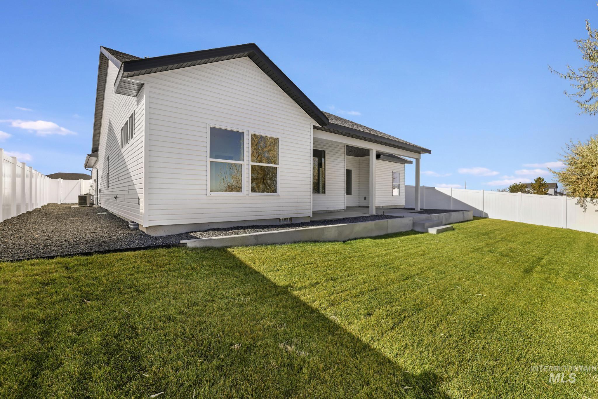 941 Gregory Way Twin Falls, ID 83301 - Photo 34 of 40 Back of house with a fenced backyard and a patio