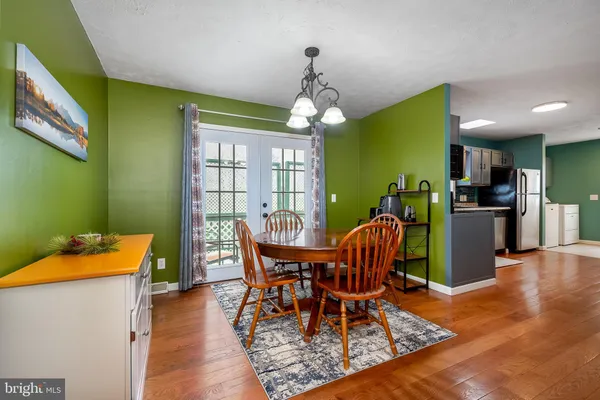 a dining room with furniture and window