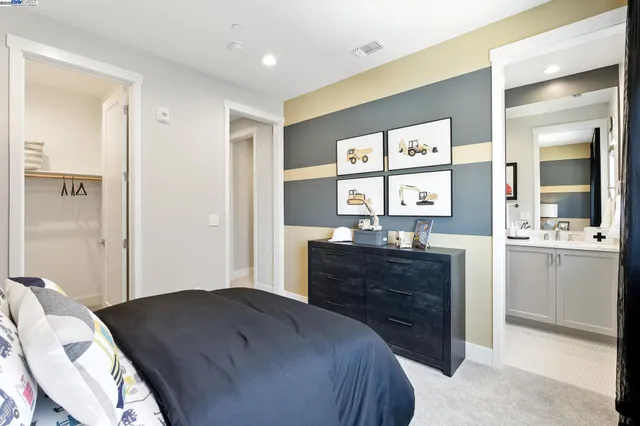 a bedroom with a bed and a dresser