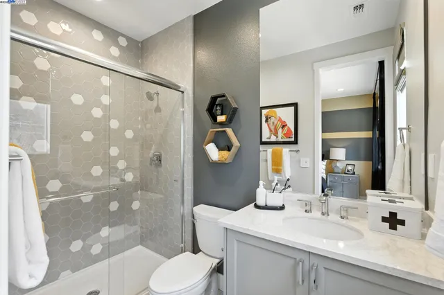 a bathroom with a toilet sink and shower