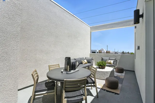 a view of a dining room with furniture and a window