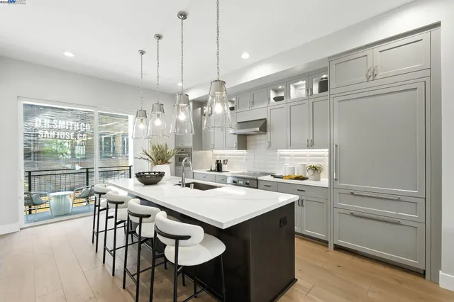 a kitchen with a table chairs stove and cabinets