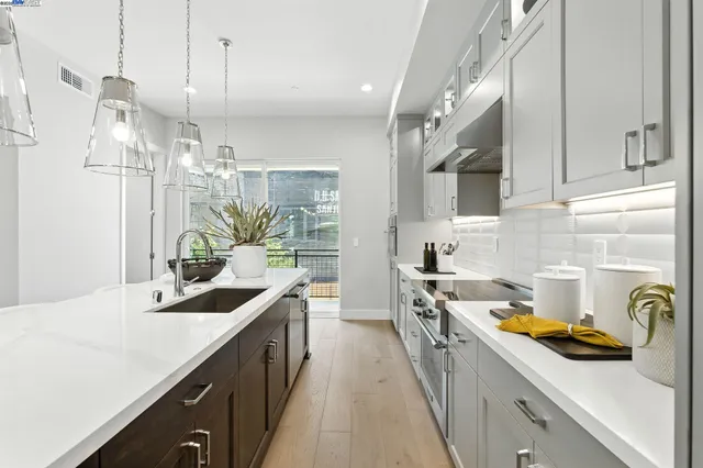 a kitchen that has a lot of cabinets in it