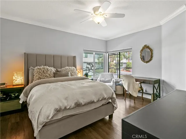 a large bedroom with a bed and window