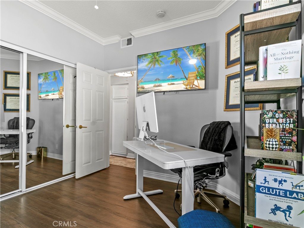 210 Lille Lane, Unit 218 Newport Beach, CA 92663 - Photo 25 of 45 a view of a workspace with furniture and wooden floor