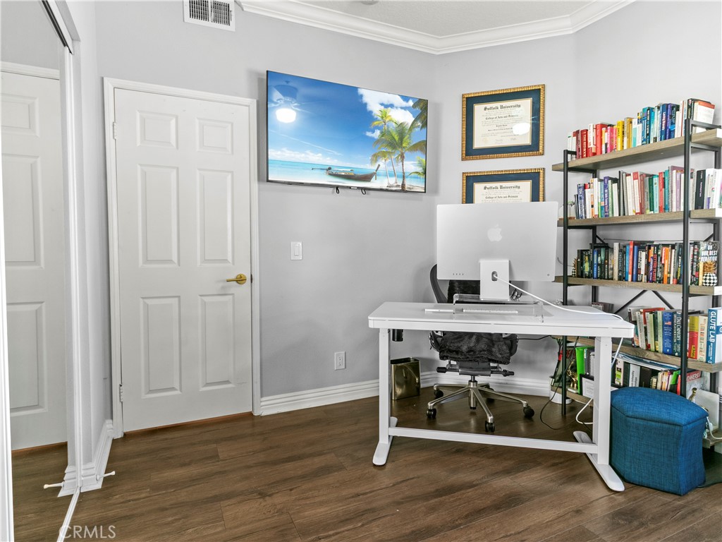 210 Lille Lane, Unit 218 Newport Beach, CA 92663 - Photo 26 of 45 a view of a workspace with furniture and toys