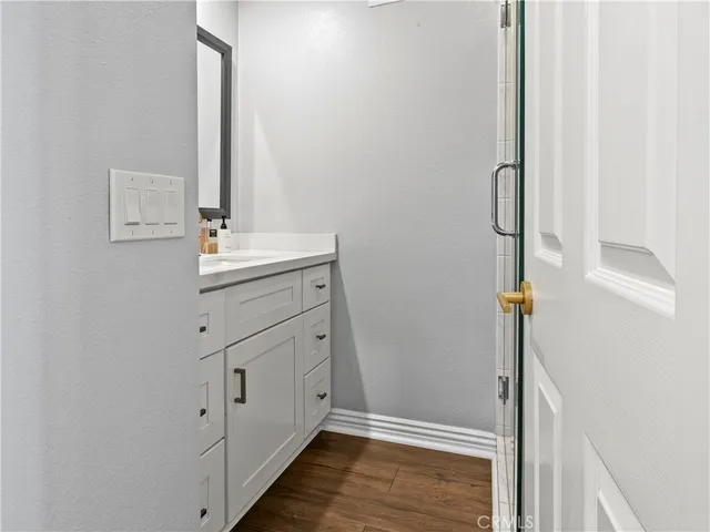 a bathroom with a sink and mirror