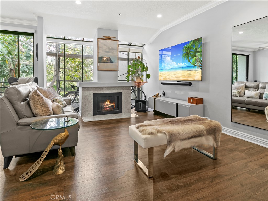 210 Lille Lane, Unit 218 Newport Beach, CA 92663 - Photo 3 of 45 a living room with furniture fireplace and flat screen tv