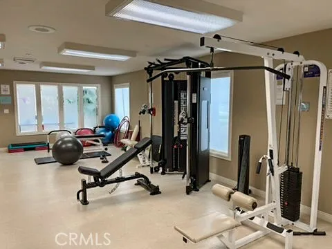 a view of a livingroom with gym equipment