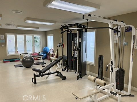 210 Lille Lane, Unit 218 Newport Beach, CA 92663 - Photo 36 of 45 a view of a livingroom with gym equipment