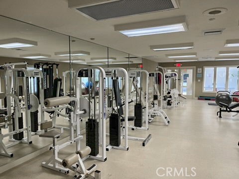 210 Lille Lane, Unit 218 Newport Beach, CA 92663 - Photo 37 of 45 a view of a room with gym equipment