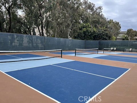 210 Lille Lane, Unit 218 Newport Beach, CA 92663 - Photo 39 of 45 a view of a tennis court