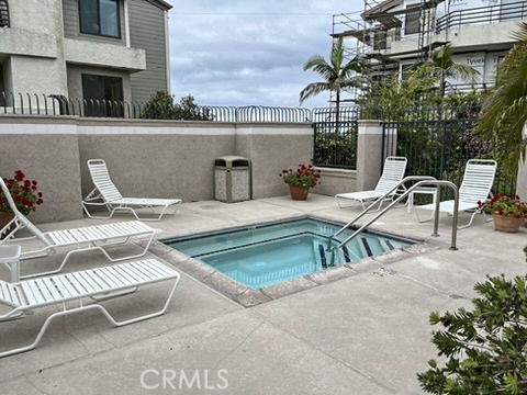 210 Lille Lane, Unit 218 Newport Beach, CA 92663 - Photo 45 of 45 a view of house with outdoor seating space