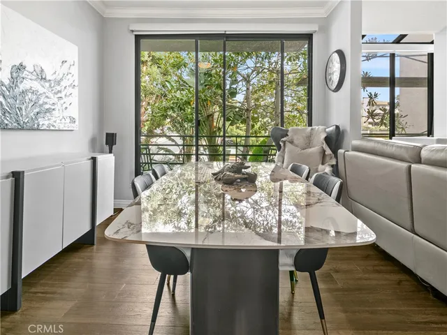 a living room with furniture and large windows