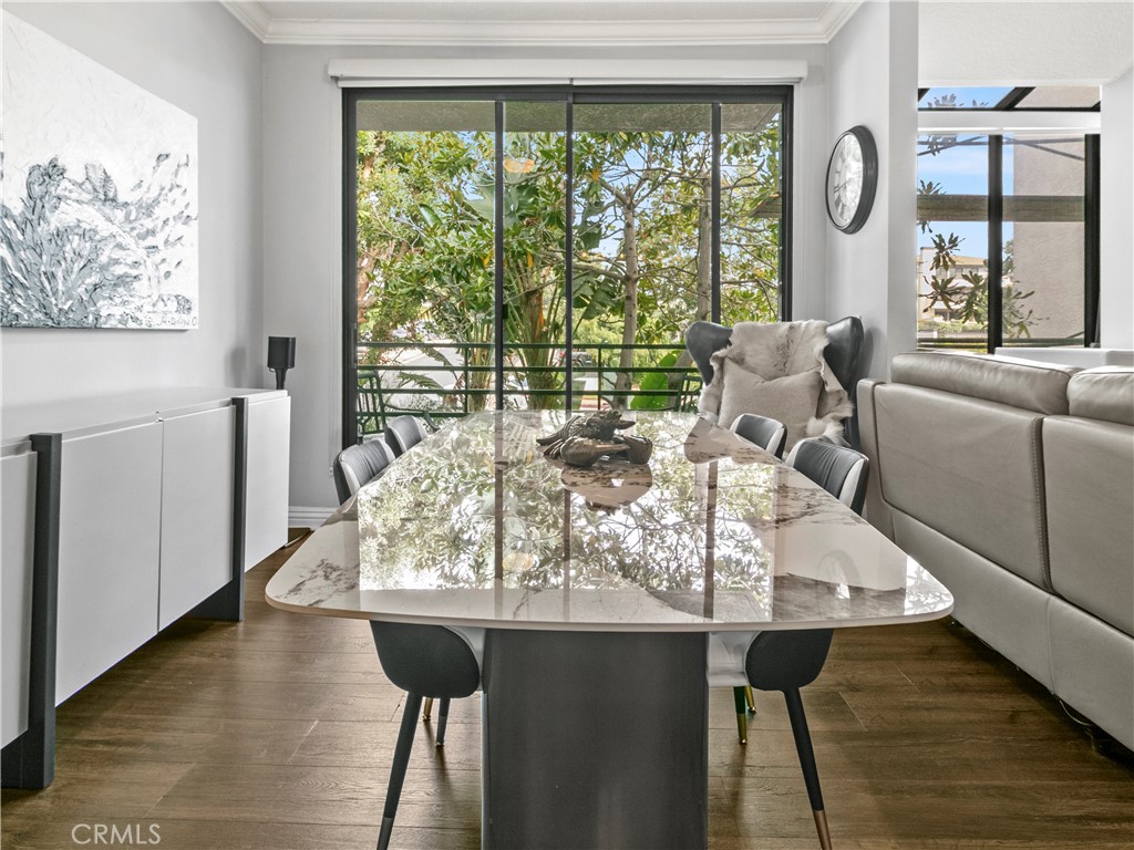 210 Lille Lane, Unit 218 Newport Beach, CA 92663 - Photo 7 of 45 a living room with furniture and large windows
