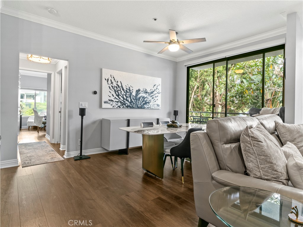210 Lille Lane, Unit 218 Newport Beach, CA 92663 - Photo 9 of 45 a living room with furniture and a large window