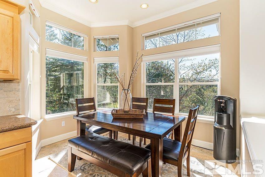 3355 Sierra Crest Way Reno, NV 89519 - Photo 4 of 25 a view of a dining room with furniture large windows and wooden floor