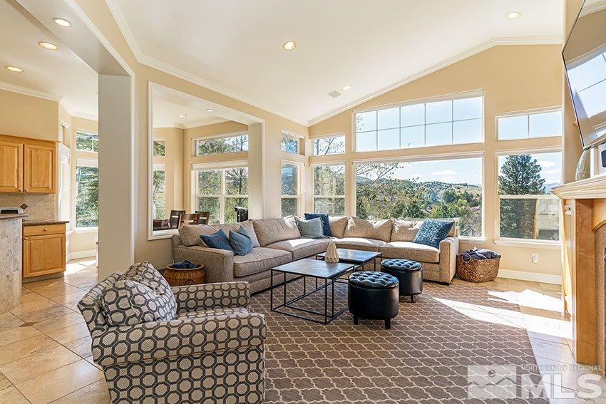 3355 Sierra Crest Way Reno, NV 89519 - Photo 5 of 25 a living room with furniture large windows and wooden floor
