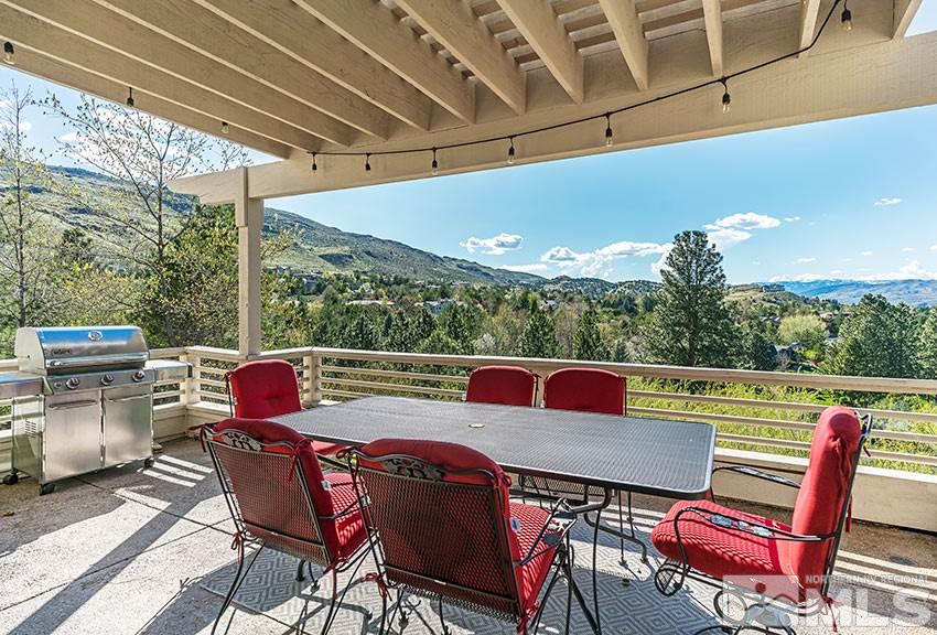 3355 Sierra Crest Way Reno, NV 89519 - Photo 8 of 25 a view of a patio with a dining table chairs and a barbeque