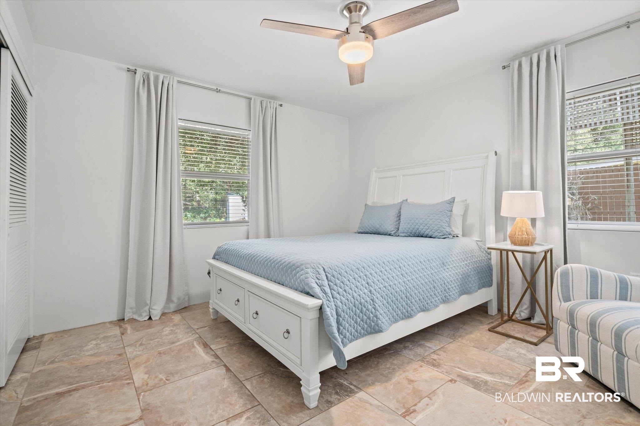 3720 Rabbit Creek Court Theodore, AL 36582 - Photo 14 of 47 Bedroom featuring light stone finish floors and ceiling fan