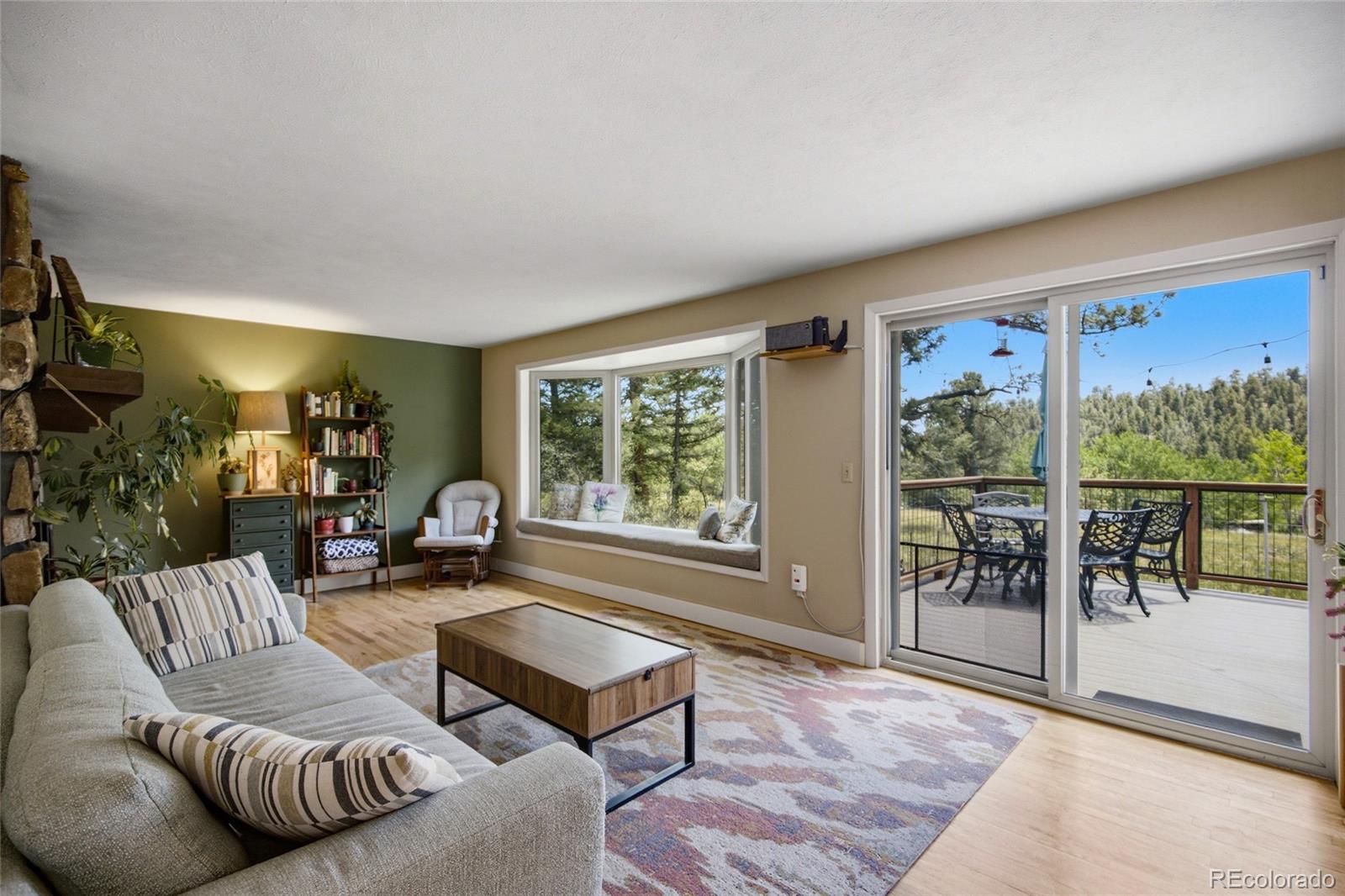 31280 Florence Road Conifer, CO 80433 - Photo 4 of 48 a living room with furniture and a large window