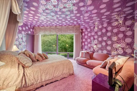 a bed room with a bed and a couch