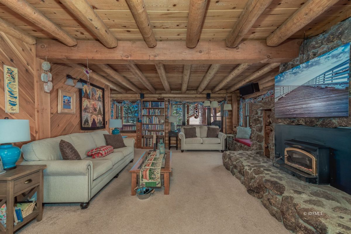 25264 Cougar Road Idyllwild, CA 92549 - Photo 19 of 40 a living room with furniture and a fireplace